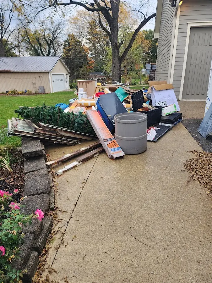 Dumpster being loaded with debris for 3 Yard Dumpster Rental in Albany